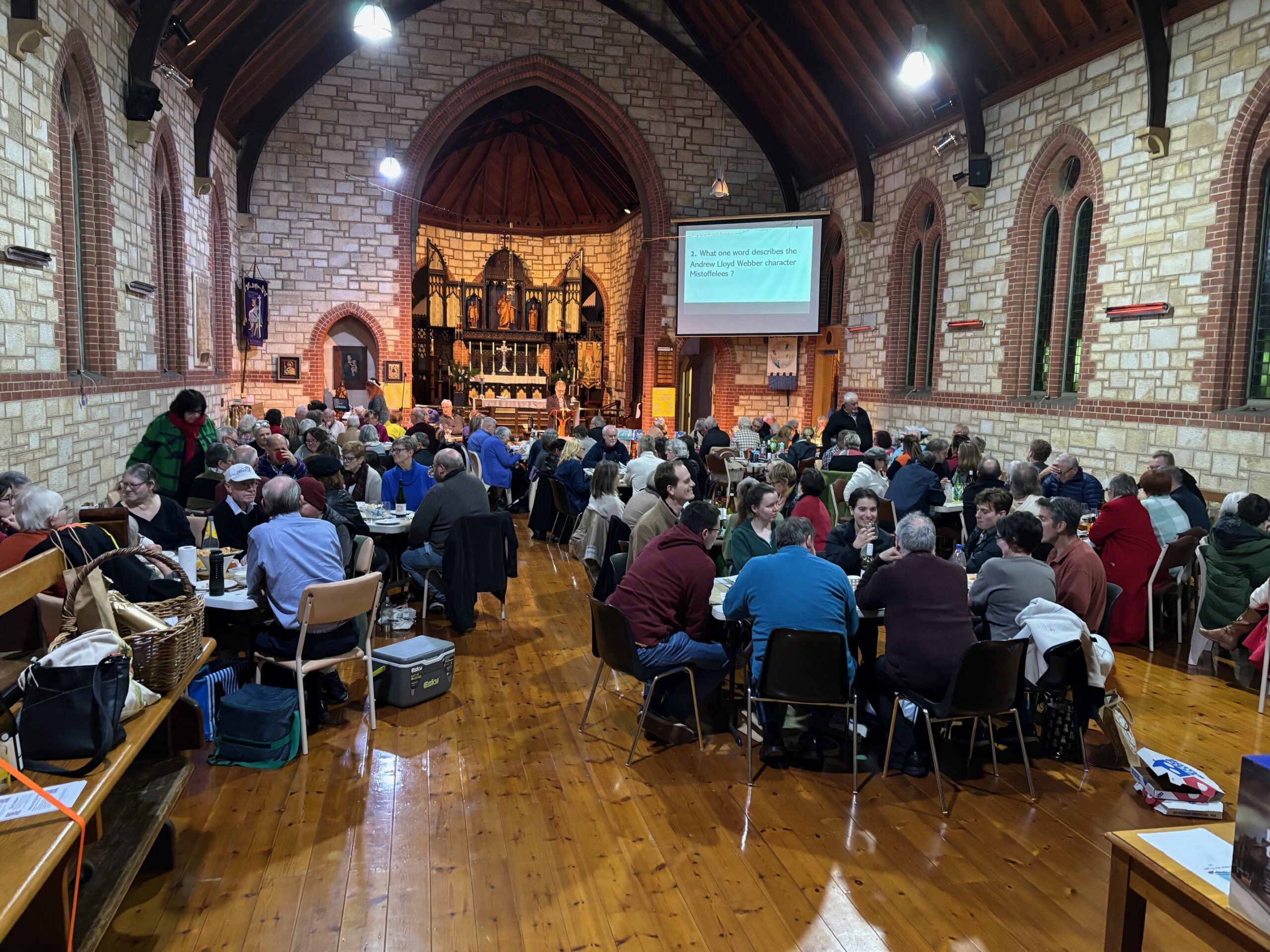 people sitting around tables in church